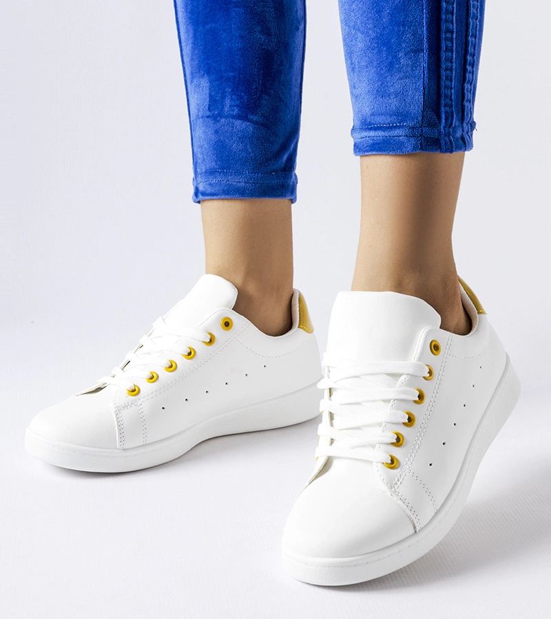 Fehér teniszcipők sárga díszítéssel Bushnell